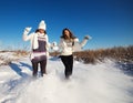 Two girlfriends have fun at winter day