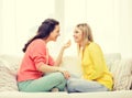 Two girlfriends having a talk at home Royalty Free Stock Photo