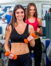 Woman holding dumbbell workout at gym. Royalty Free Stock Photo