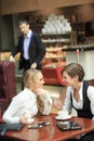 Two girlfriends office staff. in cafe on a Royalty Free Stock Photo