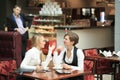 Two girlfriends office staff. in cafe on a Royalty Free Stock Photo
