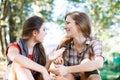 Two girlfriends outdoor talking Royalty Free Stock Photo