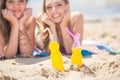 Two girlfriends resting on the beach Royalty Free Stock Photo