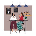 Two girlfriends sitting and drinking coffee at caf. Women talking and relaxing in everyday routine. Coffee house concept.