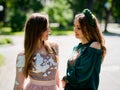 Two girlfriends young girls in luxurious dresses are posing. Royalty Free Stock Photo