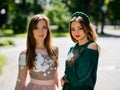 Two girlfriends young girls in luxurious dresses are posing. Royalty Free Stock Photo