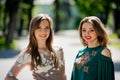 Two girlfriends young girls in luxurious dresses are posing. Royalty Free Stock Photo