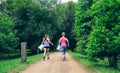 Two girls on back doing plogging Royalty Free Stock Photo