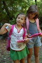 Two girls with backpacks