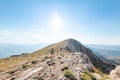 two girls with backpacks walk along a mountain path Royalty Free Stock Photo