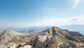 two girls with backpacks walk along a mountain path Royalty Free Stock Photo