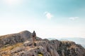 two girls with backpacks walk along a mountain path Royalty Free Stock Photo