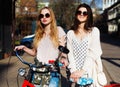 Two Girls on a bicycle. Outdoor