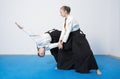 Two girls in black hakama practice Aikido Royalty Free Stock Photo