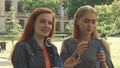 Two girls blowing bubbles outdoors Royalty Free Stock Photo