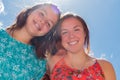 Two Girls With Blue Sky and Sunlight in the Background