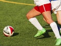 Two female high school soccer players chasing the ball Royalty Free Stock Photo