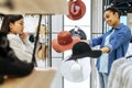 Two girls choosing hats in clothing store Royalty Free Stock Photo