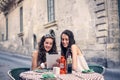 Two girls choosing what to eat