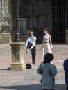 two girls dancing and recording a video on main square in Oviedo Royalty Free Stock Photo