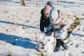 Two girls of different ages have fun and actively spend time on a winter walk Royalty Free Stock Photo