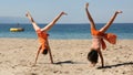 Two girls doing cartwheel Royalty Free Stock Photo