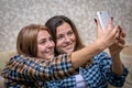 Two girls doing selfie indoors Royalty Free Stock Photo