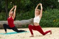 Two girls doing yoga and outdoor meditation, pair yoga classes, healthy lifestyle, meditation and wellness Royalty Free Stock Photo