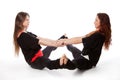 Two girls doing yoga