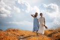 Two girls in dresses in autumn field Royalty Free Stock Photo