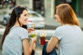 Two girls drink cold cocktails Royalty Free Stock Photo