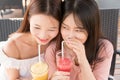 Two girls drinking juice Royalty Free Stock Photo