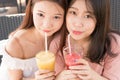 Two girls drinking juice Royalty Free Stock Photo