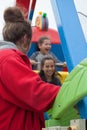 Two girls enjoying a fair ride in the UK