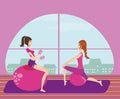 Two girls exercising with Pilates fit balls. Royalty Free Stock Photo