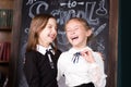 Back to school. Portrait of two girls, first graders.