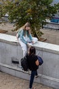 Two girls-friends on the embankment of the Moscow river