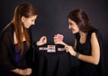 Two girls friends engaged in fortune-telling cards Royalty Free Stock Photo