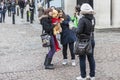 Two girls friends posing with a big toy bear won at the christmas fair