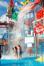 Two girls get dunked at a water park