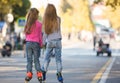 Two girls girlfriends rollerblading on the mall Royalty Free Stock Photo
