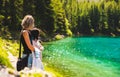 Two girls at green lake shore in styria, Austria