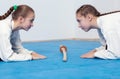 Two girls in hakama bow on Aikido training