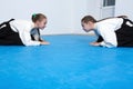 Two girls in hakama bow on Aikido training Royalty Free Stock Photo