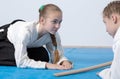 Two girls in hakama bow on Aikido training Royalty Free Stock Photo