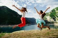 Two girls happy jump in mountains Royalty Free Stock Photo