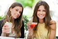 Two girls having an aperitif outdoor