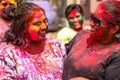 Two girls having colours on their faces