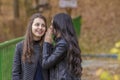 Two girls having fun in autumn park Royalty Free Stock Photo