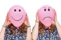 Two girls holding pink balloons with facial expressions for head Royalty Free Stock Photo